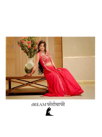 A portrait of bride Sanya in a vibrant red lehenga, looking elegant and poised.