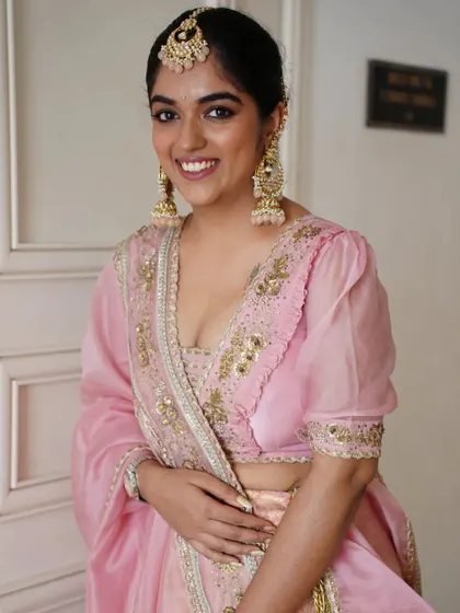 The smile of a happy Punjabi bride. Her makeup is kept bright and luminous to match the celebratory feel of her Anand Karaj ceremony.