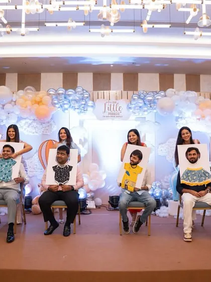 A fun game of 'dress the dad' at a baby shower, bringing out everyone's competitive and creative side.