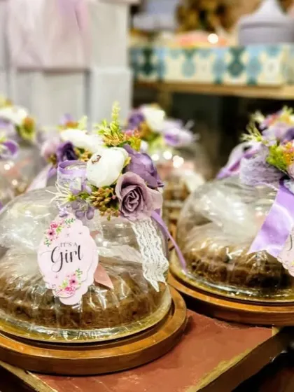 For this baby girl announcement, I packaged delicious cakes in these beautiful cloche domes, decorated with floral arrangements and custom 'It's a Girl' tags.