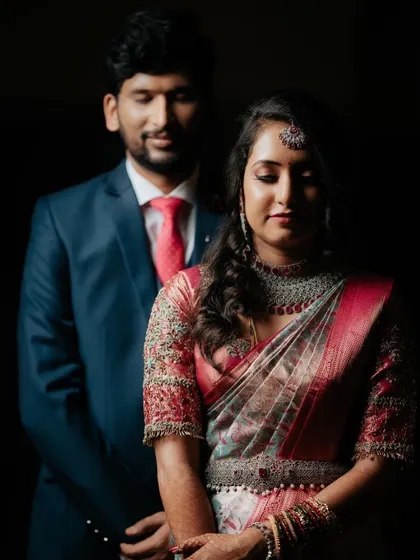 A moody and romantic portrait of the couple, their faces softly lit, creating an intimate and cinematic feel.