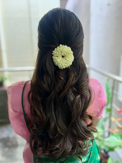 A perfect hairstyle for a simple, elegant look. The soft curls are timeless and suit any occasion.