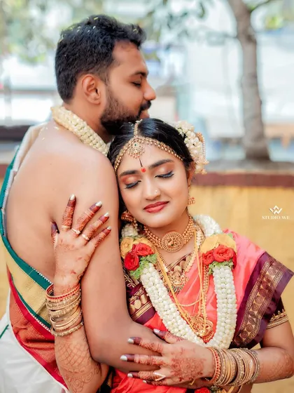 A close and loving embrace between the couple, capturing the warmth and security of their relationship.