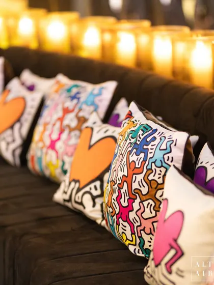 Even the cushions were part of the art in our Keith Haring room. These custom-printed pillows featured his iconic colorful figures and hearts, adding to the immersive experience.