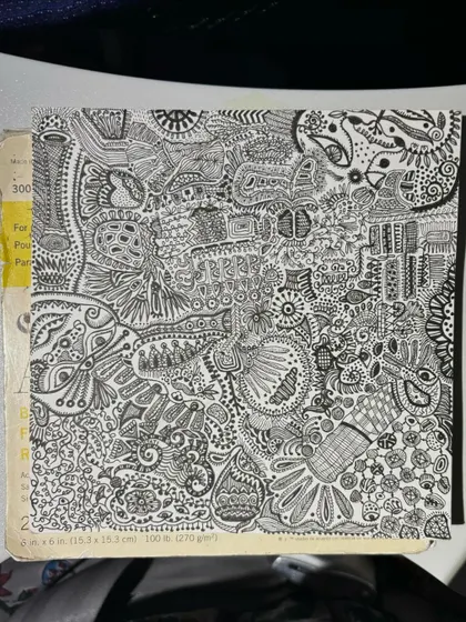 The completed drawing resting on a book. It's a journey captured on paper.