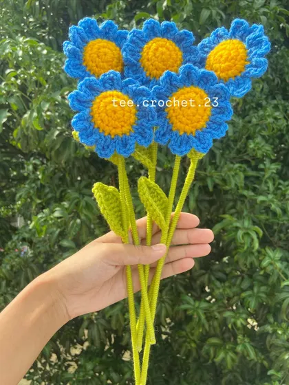 A bouquet of bright blue stuffed daisies, perfect for adding a pop of color.