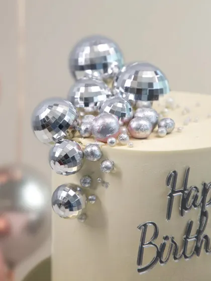 A detailed look at the fun and festive disco ball decorations, perfect for the life of the party.