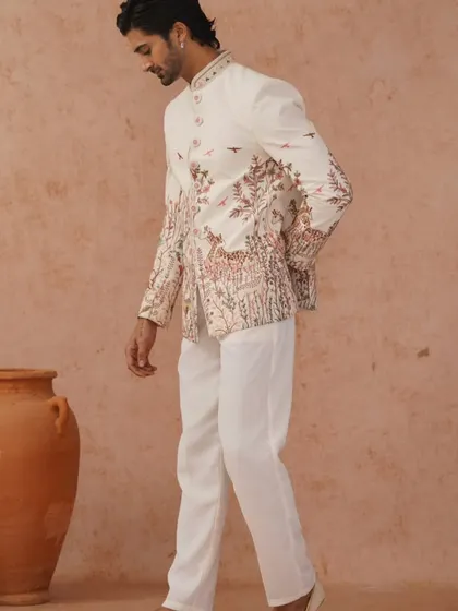 Another professional shot of the nature-inspired embroidered Jodhpuri, showing the model in motion.
