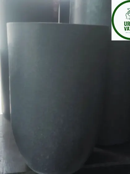 A dark grey, U-shaped fiber pot.