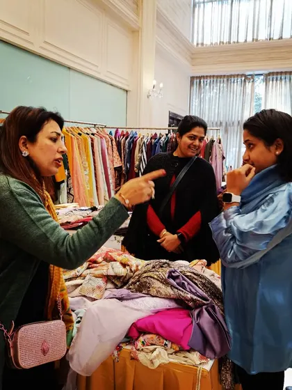 An animated discussion at a clothing stall. I love seeing vendors passionately share the story of their brand with customers.