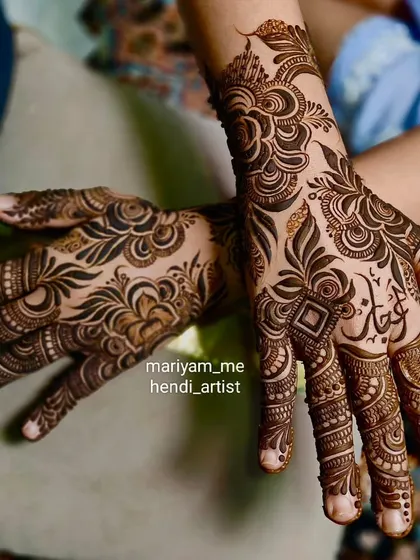 A stunning floral back-hand design in the Dubai style, with a custom name.