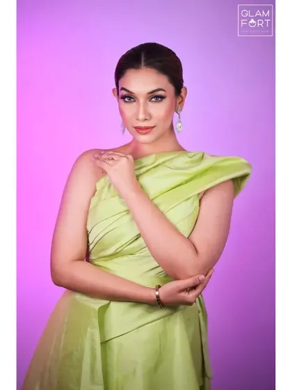 A portrait against a pink background. The makeup is versatile enough to work with different settings, always looking fresh and beautiful.