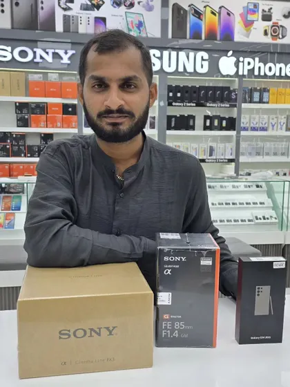 A picture of me with my new Sony camera and lens. I believe in investing in professional-grade equipment to ensure the highest quality for your films.