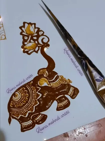 A practice piece of a decorated elephant with its trunk holding a lotus spray. This combines two popular traditional motifs in one design.