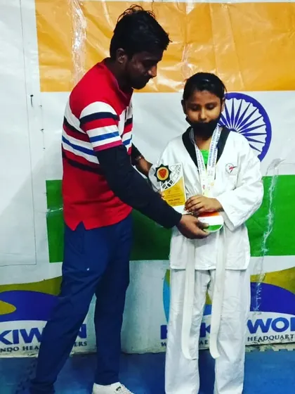 Presenting the trophy to one of my girl champions.