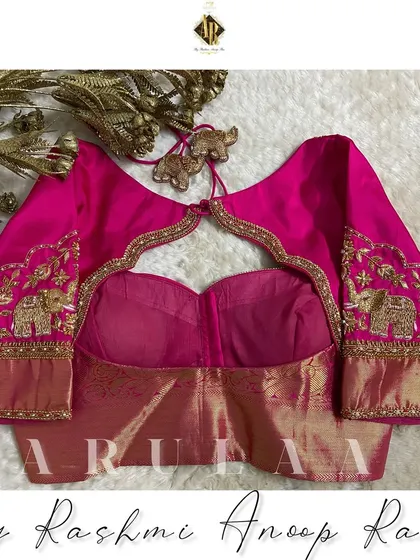The back view of the elephant motif blouse, showing a beautiful keyhole cutout framed with detailed zardosi work. It’s all about creating a complete, 360-degree design.