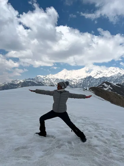 Finding my inner warrior with Virabhadrasana II on the snowy summit of Surya Top. The crisp mountain air and the vastness of the Gangotri range create a powerful backdrop for this pose of strength and focus.