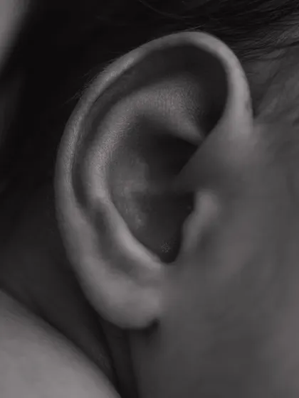 The perfect swirl of a tiny ear. I love capturing these small, intricate details in black and white to create timeless, artistic portraits.
