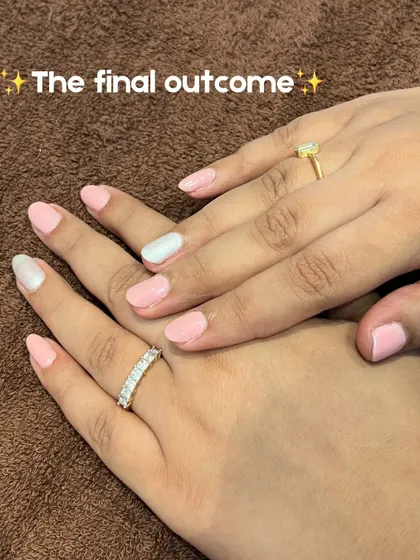 The final outcome! A beautiful, clean set of nails with a soft pink base and a chic white accent nail.