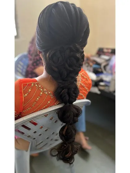 The unadorned version of the modern bubble braid, showing the intricate weaving before the accessories are added. This client also used my saree draping service.