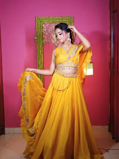 Another full-length shot of the yellow Haldi lehenga, showing its beautiful flow and movement.