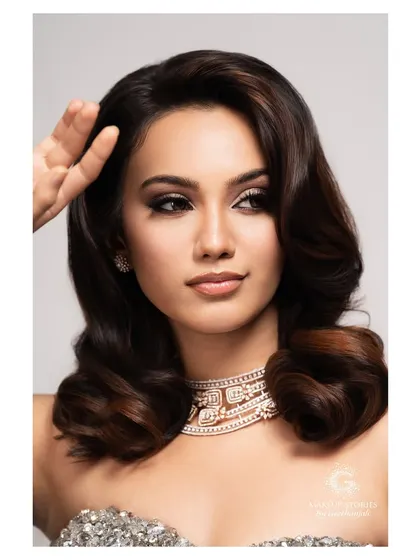 A beautiful close up portrait from the luxe glam shoot. The makeup features soft, voluminous hair and a perfectly blended smokey eye, showcasing a sophisticated and modern beauty standard.