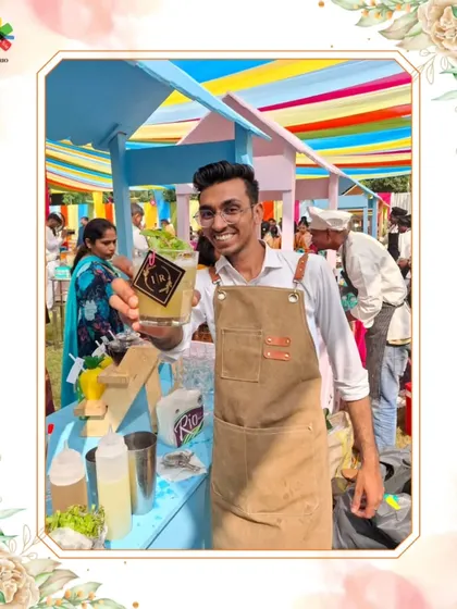 Our mixologist proudly presents a freshly made cocktail at a colorful outdoor event. The smile and quality drink represent our commitment to excellent service and guest satisfaction.