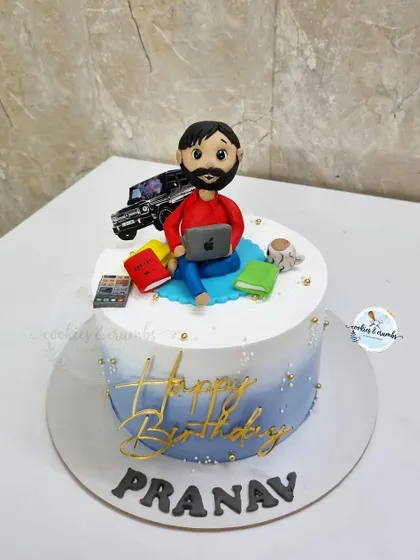 A birthday cake for a workaholic who loves his coffee and his car. I included a fondant figure with a laptop, books, a coffee mug, and his Thar jeep.