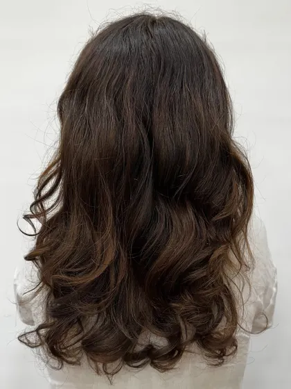 The "before" of our Cowboy Copper transformation. You can see the hair was previously colored and ready for a warm, coppery refresh.