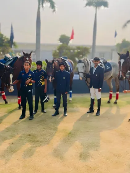 A group of our riders and instructors ready for a session. The team includes both male and female riders of different ages.