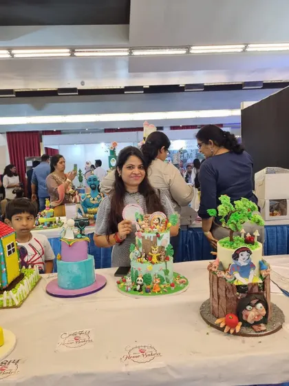 A wider view of the competition floor, with my jungle cake among other incredible creations. It's an honor to be part of such a talented community of bakers.