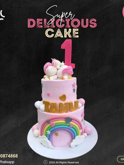 A magnificent two-tier unicorn cake for a first birthday. This pink creation features a sleeping unicorn on top, a vibrant rainbow, and personalized details for a magical milestone celebration.