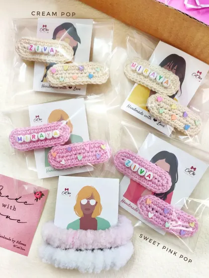 Showing our "Cream Pop" and "Sweet Pink Pop" color options for the name clips. These were made for Ziva and Miraya, complete with our custom backing cards.
