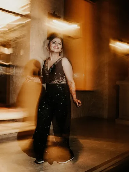 Capturing the spirit of the dance. This motion blur shot highlights the bride's happy expression while the swirling lights and movement create a vibrant, energetic feel.