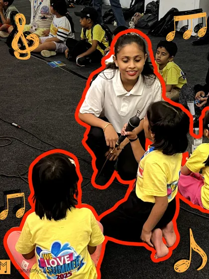 A young girl gets her first chance to sing into a microphone during our summer camp. These moments are magical, sparking a child's dream of becoming a performer.