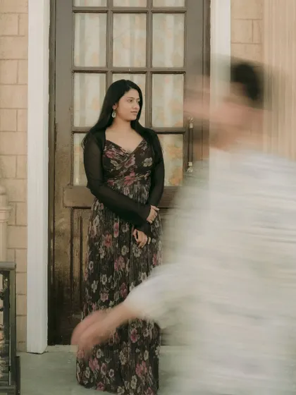 An artistic shot using motion blur to create a sense of a fleeting, dreamlike moment between the couple.
