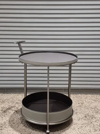 This two-tiered bar cart or serving trolley in grey and chrome is a stylish and mobile addition to any living or dining area.