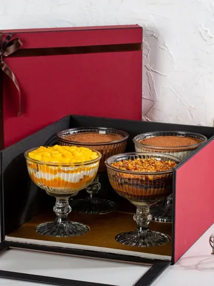 Why pick one flavour when you can have four? Our four-flavour gift box is one of our newest and most popular sets, allowing you to sample a variety of our best-selling trifles and mousses.