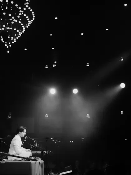 Under the spotlight at The Piano Man. This wide shot shows the scale and atmosphere of 'The Mehtab Ali Niazi Experience', perfect for clients looking for a visually and musically impressive stage presence.