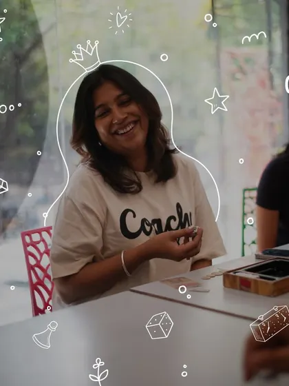 The smile of a winner, or maybe just someone having a great time. Our board game sessions are designed to be fun, social, and engaging for everyone at the table.