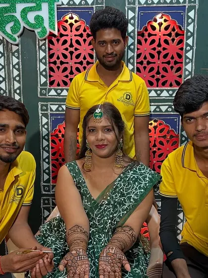 The team with a happy bride after completing her beautiful mehndi.