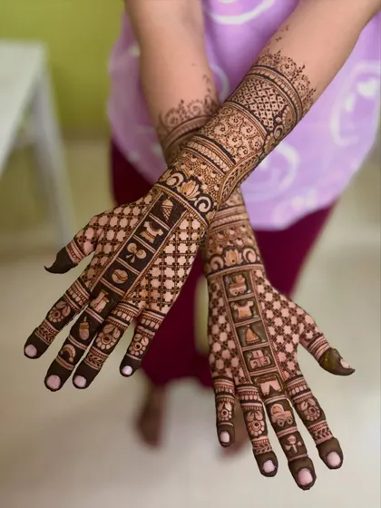 The back of the hands for Swathi's baby shower, featuring intricate geometric and checkerboard patterns that complement the story on the front.