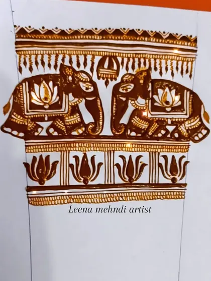 A beautiful and symmetrical armband design featuring two elephants and lotus borders. This is a classic pattern for bridal henna.