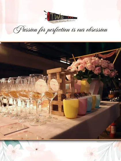 A stylish display of glassware for a Sangeet night, including custom tags and flamingo stirrers.
