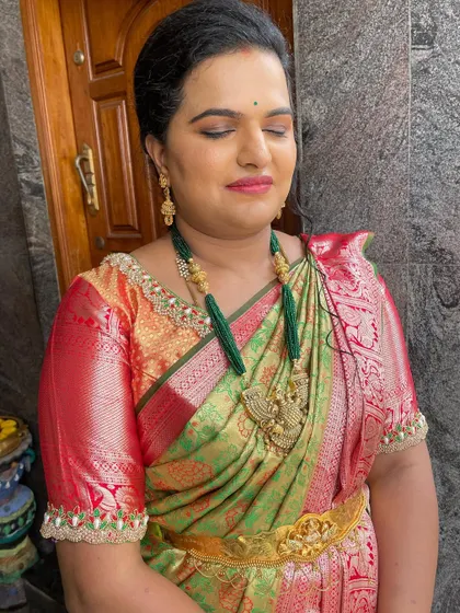 Vidhya celebrating her housewarming ceremony. I gave her a classic look with a defined eye and a warm lip color to match her beautiful green and red silk saree.