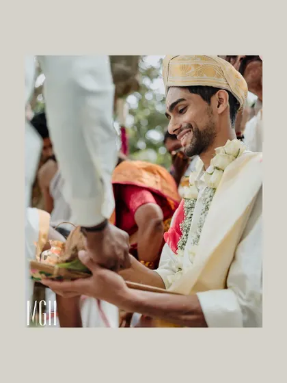 A candid shot of the groom smiling as he participates in a wedding ritual. My goal is to capture these genuine moments of happiness throughout the ceremony.