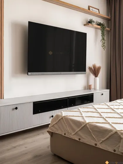 A sleek, wall-mounted TV unit in the bedroom provides storage without taking up floor space. The light color palette and clean lines contribute to the room's airy and uncluttered feel.