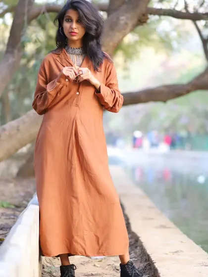 A duplicate of 107, this photo shows the elegant drape of the dress.