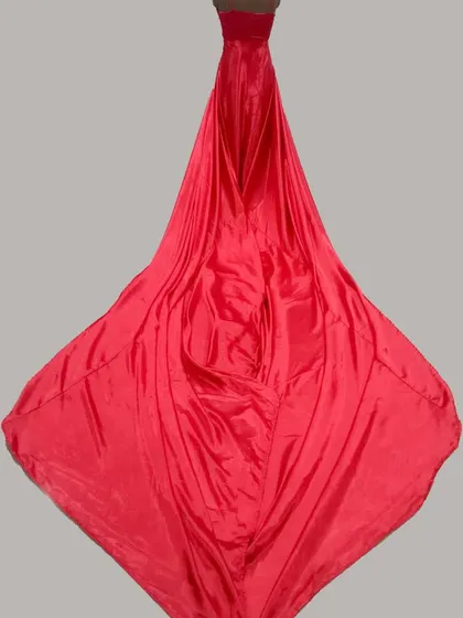 This angle highlights the sheer volume and length of the trail on our red satin maternity gown, a key feature for achieving those sought-after dramatic shots.