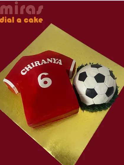 A dream cake for a Cristiano Ronaldo fan. This set includes a sculpted football and a cake shaped like a number 6 jersey, perfect for celebrating a football-loving birthday boy.